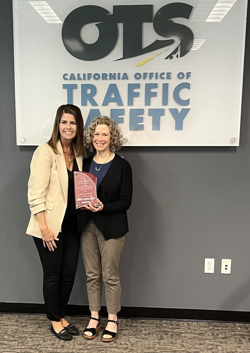 Left to right: OTS Director Barbara Rooney presents SafeTREC Co-director Jill Cooper with Traffic Sa