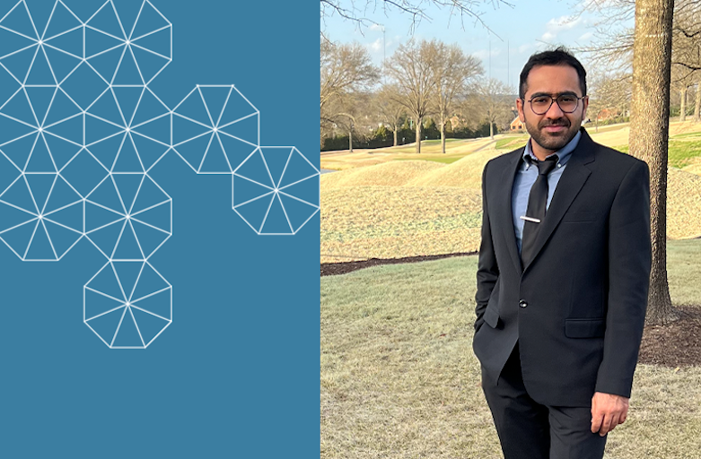 Postdoctoral Researcher Iman Mahdinia, smiling, wearing glasses and in a dark blue suit, outdoors