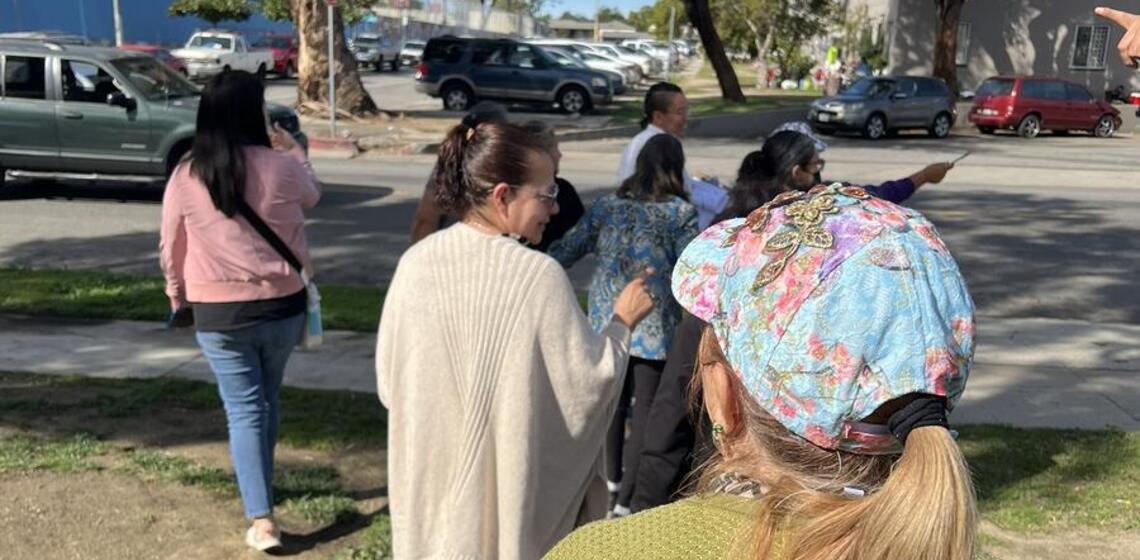 Adults participate in a walking and biking assessment in the Boyle Heights area of Los Angeles, California.