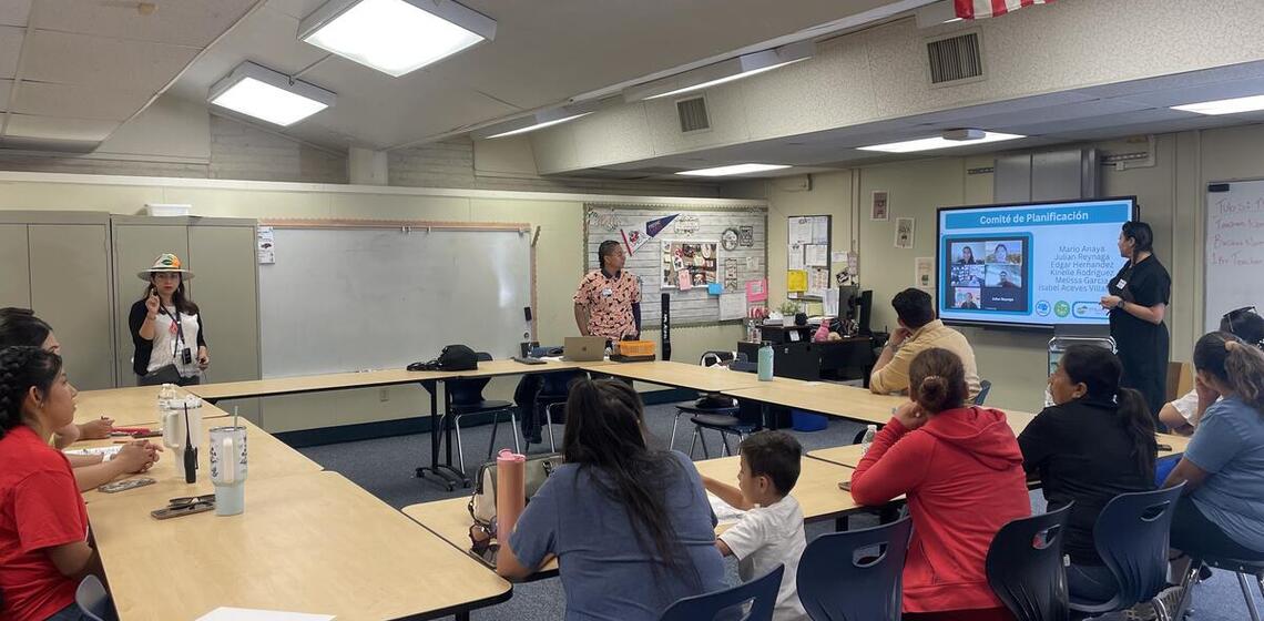 Two facilitators led a training at a school in Tulare, California that included adult and school-aged participants.