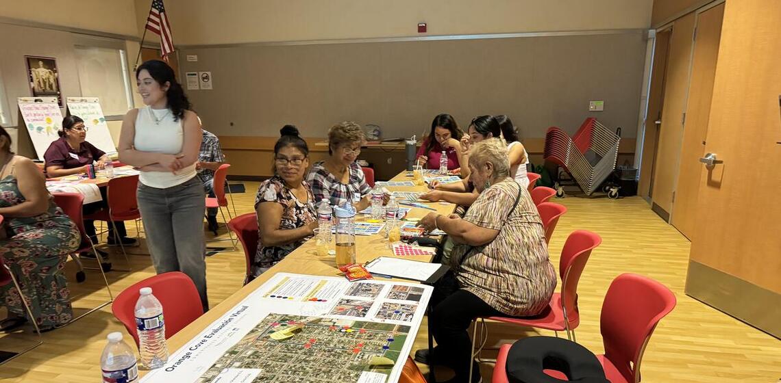 An instructor leads a group at a workshop.