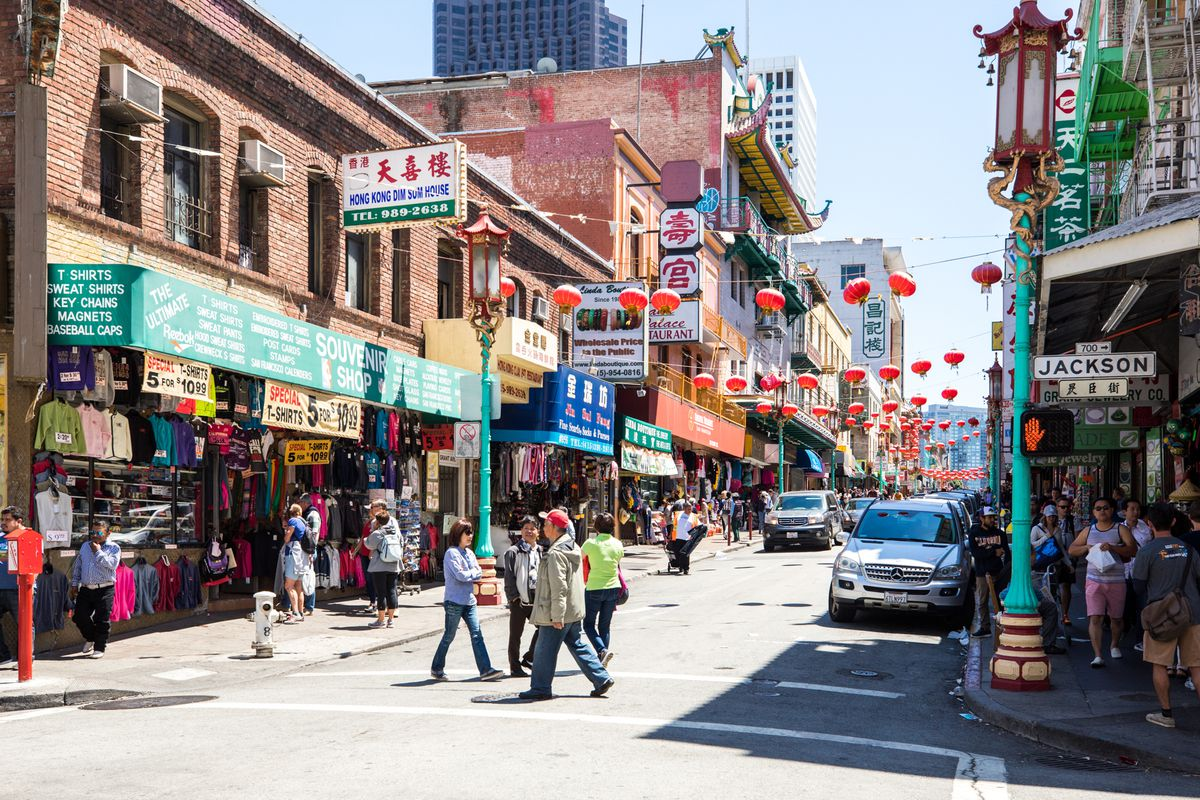 Image of pedestrians crossing the street in San Francisco’s Chinatown. 