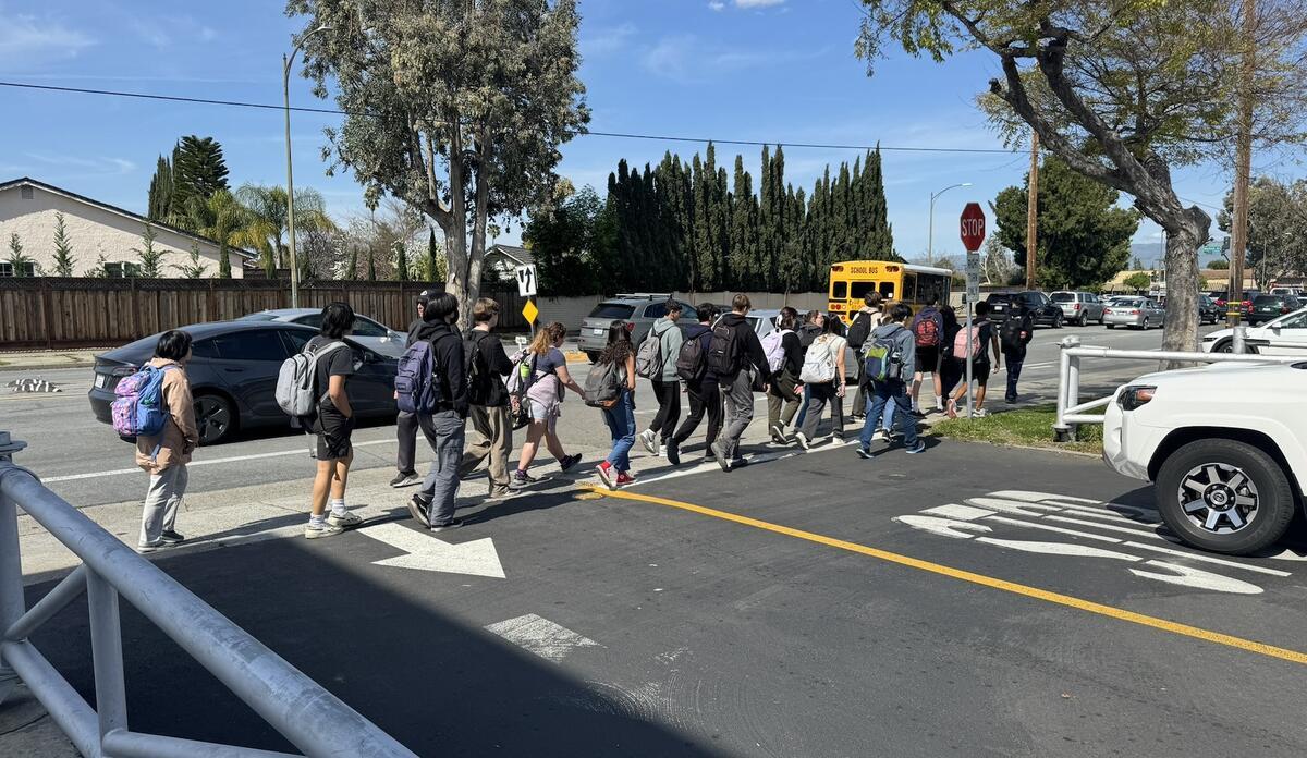 Students in crosswalk in front of Branham High School