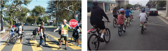 Children biking and walking on street and in crosswalk