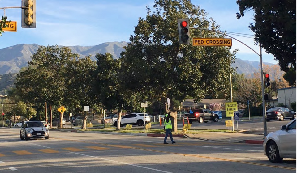 Crossing guard at an intersection for a pedestrian crossing in Claremont, CA