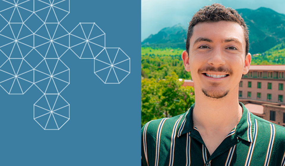 Graduate Student Researcher Kyler Blodgett, smiling wearing a green striped shirt with a hill in the background
