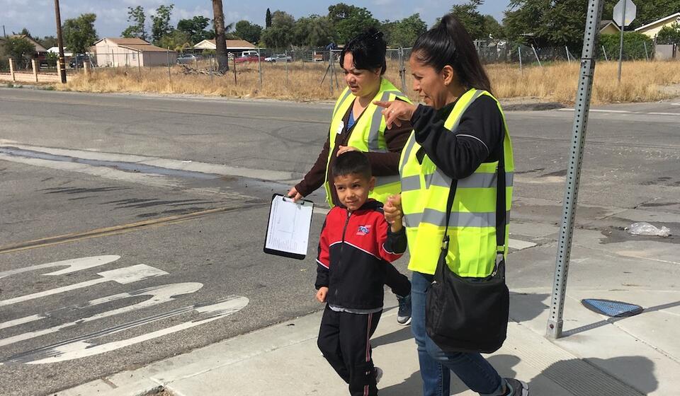 Two women and a young boy on a walk assessment in Muscoy, CA