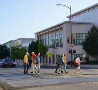 People walking in crosswalk on Milvia Street in Berkeley