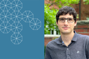 Matt Raifman, smiling, wearing glasses and a gray button up, stands before a leafy tree and brick background with a light blue box with white tessellations to his left