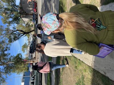 Eight people conducting a walk assessment on a neighborhood sidewalk during a Street Story training in Boyle Heights