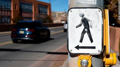 Pedestrian crosswalk button near an intersection